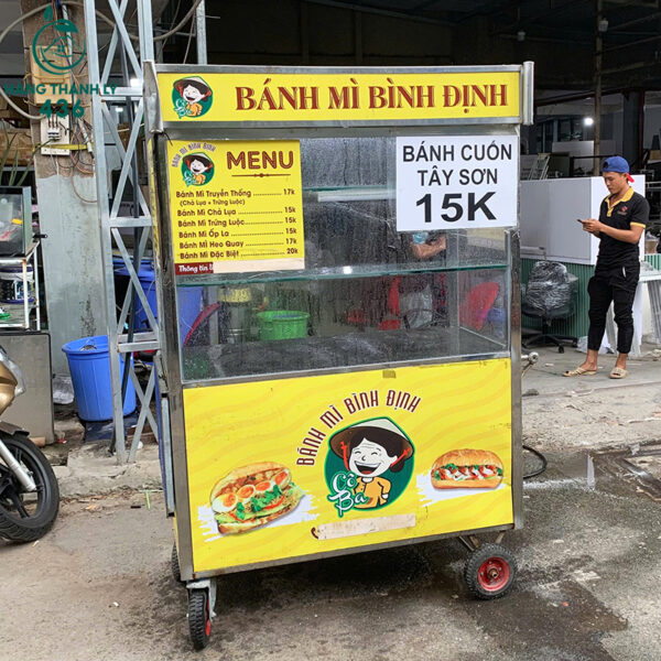 quay-ban-hang-cu-khung-kim-loai-co-banh-xe-tien-di-chuyen (1) quay ban hang cu khung kim loai co banh xe tien di chuyen 1