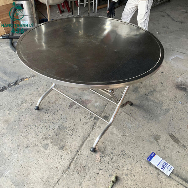 ban tron inox cu 1m2x75cm chan gap tien di chuyen 1